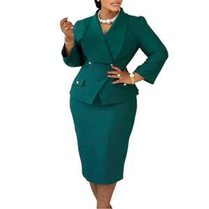 Detailed view of dark green peplum blazer suit and pencil skirt with gold buttons