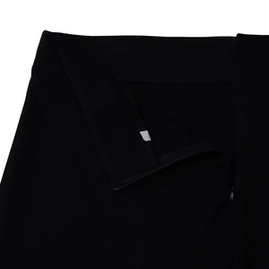 Detail of invisible zipper closure and fine stitching on elegant black fabric waistline