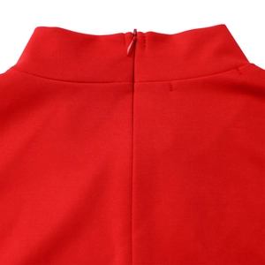 Close-up of red high neck dress showing seamless back invisible zipper and knit texture