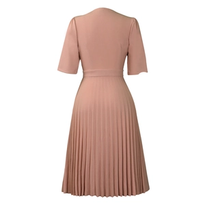 Back view of elegant dusty pink pleated dress with high waist and mid-length sleeves