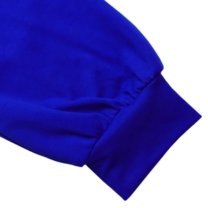 Detail of royal blue knit dress showing elastic ribbed cuffs and fine fabric texture