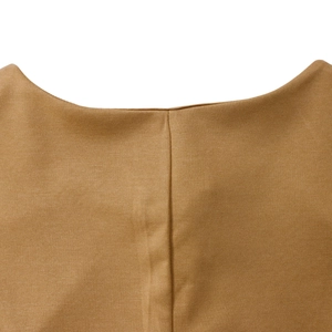 Detailed macro view of caramel knit neckline with elegant vertical stitching details