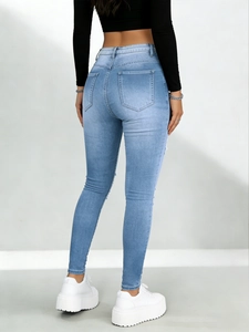 Jean skinny taille haute bleu clair pour femme en denim extensible avec effet galbant