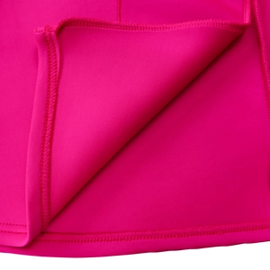 Detailed macro view of hot pink dress hem with professional stitching and high-stretch fabric