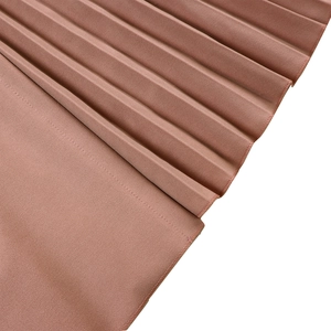 Detailed macro shot of elegant bean paste pink pleated fabric with fine stitching