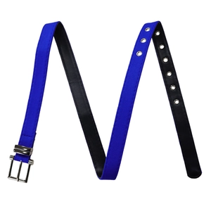 Detail of royal blue fabric belt with square silver buckle and metal eyelets for dress