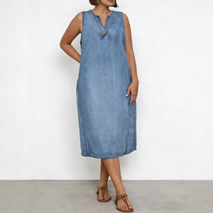 Detail view of a V-neck light blue denim sleeveless maxi dress with a decorative button