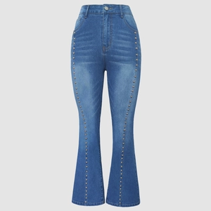 Detailed view of side metal rivets and gradient wash on high waist flare jeans