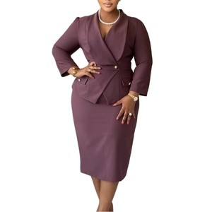 Close-up of deep purple blazer with lapel collar and metallic double-breasted buttons