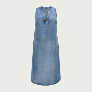 Close-up of V-neckline with vintage button detail on light blue denim dress