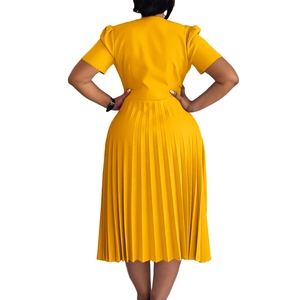 Detailed back view of yellow short-sleeved dress with elegant pleated midi skirt
