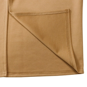 Close-up of double-needle hem stitching on mustard yellow knitted fashion set