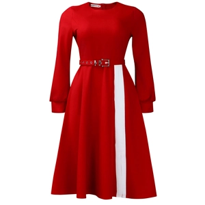 Detail of red long sleeve dress featuring white contrast panel and waist belt with silver buckle