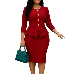Detail view of the red two-piece suit showing golden buttons and ruffle hemline on the top