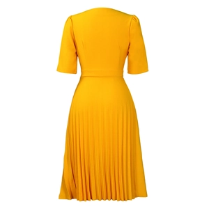 Detail view of ginger yellow dress back featuring pleated skirt and puff sleeve design