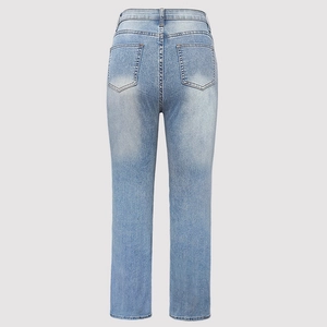 Detail view of high-waist light blue denim jeans with washed effect and back pocket design
