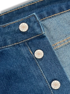 High-waisted wide-leg denim jeans featuring a vintage-style triple-button metal closure