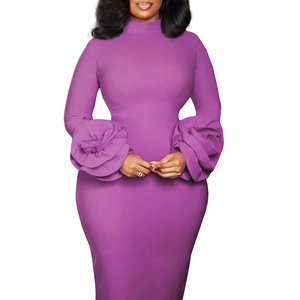 Close-up of elegant dark purple dress with 3D floral cuff detail and mock neck