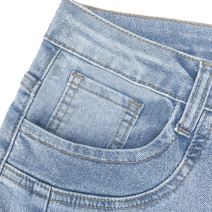 Close-up of high-waist light blue jeans showing front pockets and denim texture details