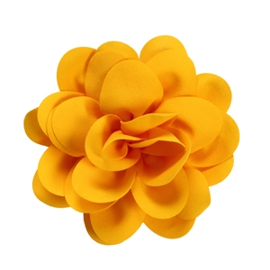 Detailed close-up of handmade bright orange fabric floral brooch with tiered petals