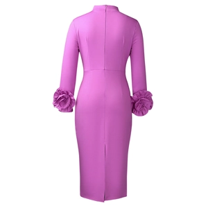 Detail of magenta slim-fit dress featuring 3D floral cuffs and a back zipper closure