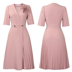 Detail of pink V-neck dress featuring pleated texture and 3D floral accent on the shoulder
