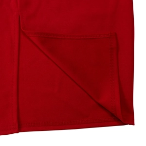 Detailed macro view of the premium red fabric stitching and refined hemline craftsmanship