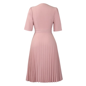 Detail of the elegant pleated skirt texture and V-neck back design on a rose pink dress