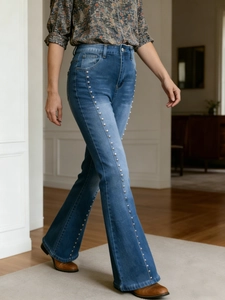 Retro high waist flared jeans in mid-blue wash with elegant pearl side embellishments