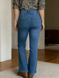 Retro high waist flared jeans with side metal rivets and a vintage gradient blue wash