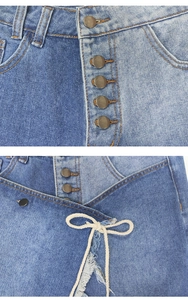 Detail showing two-tone denim patchwork jeans with metal buttons and white rope tie