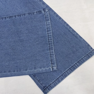 Elegant wide leg light blue denim pants with high quality stitching and texture