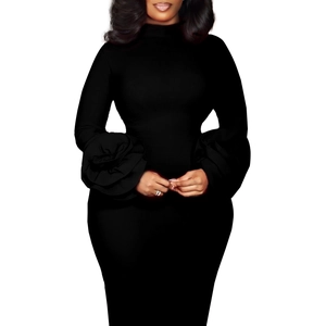 Detail of elegant black slim dress featuring unique oversized 3D floral petal sleeves