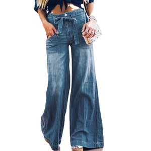 Elegant high-waisted dark blue wide-leg denim trousers with waist bow tie and large pockets