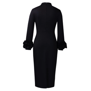 Detail of the back hidden zipper and floral cuffs on a black slim fit dress