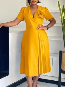 Elegant yellow V-neck pleated dress with floral accents and button waist detail