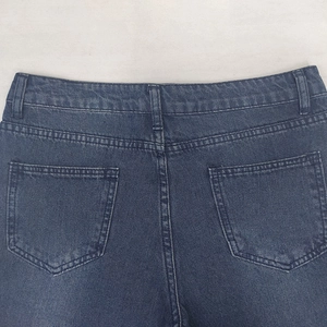 High-waisted dark blue denim jeans with classic back pockets and detailed stitching