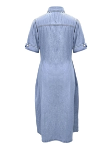 Detailed back view of a light blue denim midi dress featuring a tailored waist and yoke seam