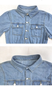 Close-up of lapel collar and metal snap buttons on a blue denim shirt dress
