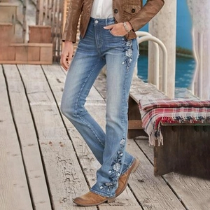 Vintage high waist flared jeans with floral embroidery in medium blue denim wash finish