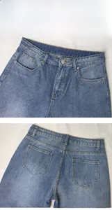 Detail view of washed blue denim jeans showing waist button and functional pockets