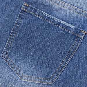 Close-up of blue denim shorts showing the classic pocket with contrast yellow stitching