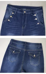 Detail view of high waist jeans with double metal buttons and large back flap pockets