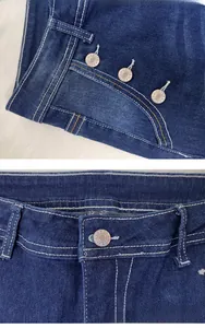 Detail view of high waist denim flare jeans with white contrast stitching and copper buttons