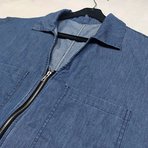 Short-sleeved blue denim V-neck dress with a metal zipper and dual chest pockets