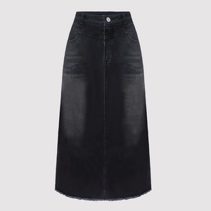 Macro detail of high-waist denim maxi skirt with button fly and distressed frayed hemline