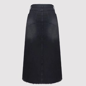 Detail of high waisted black denim skirt featuring back pockets and raw fringe hem