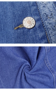 Detail view of denim jacket showing metal buttons and distressed frayed edge stitching