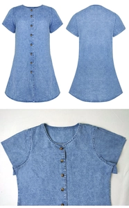 Detail of blue denim dress with snowflake wash texture and round neck buttons