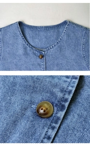 Detail of light blue denim fabric texture and amber buttons on this summer shirt dress